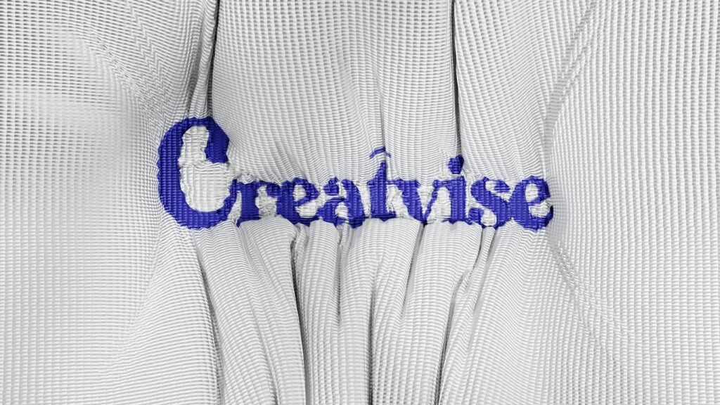 A close up of a white shirt with blue writing on it