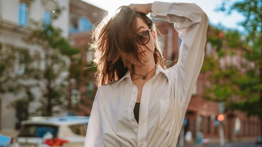 a person with the hair blowing in the wind