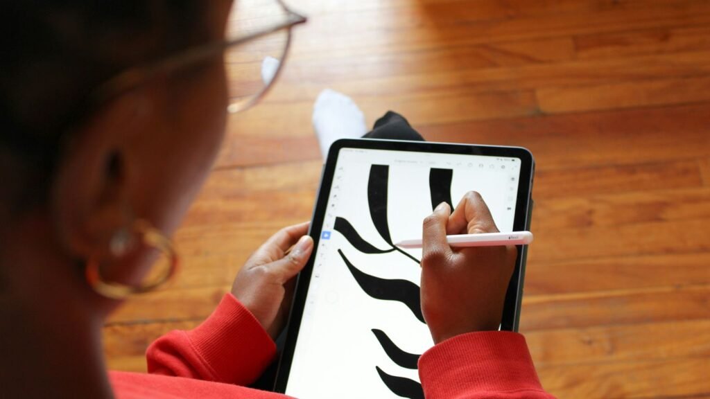 a woman is using a tablet with a zebra pattern on it